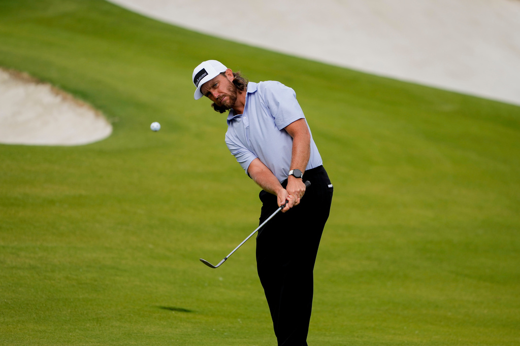 Tommy Fleetwood, of England, chips onto the 15th green during second round of the Truist Championship golf tournament at the Quail Hollow Club, Friday, May 8, 2026, in Charlotte, N.C. (AP Photo/Chris Carlson)