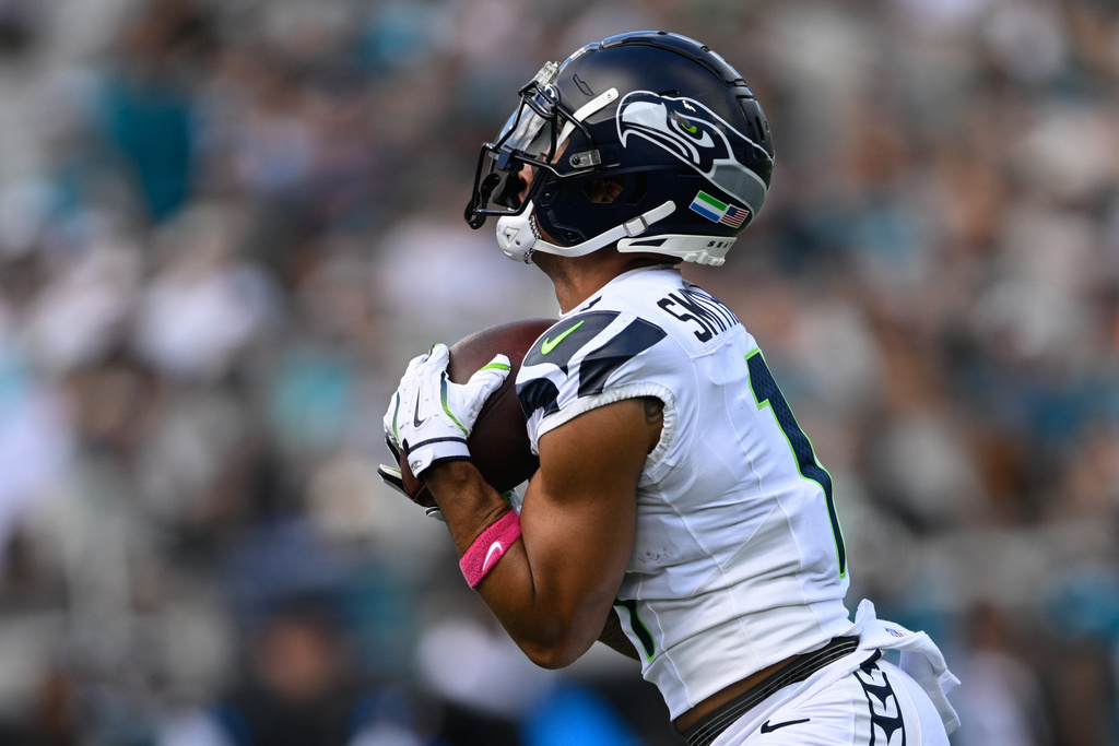 Seattle Seahawks wide receiver Jaxon Smith-Njigba catches a touchdown pass on a 61-yard pass play during the first half of an NFL football game against the Jacksonville Jaguars, Sunday, Oct. 12 2025, in Jacksonville, Fla. (AP Photo/Phelan M. Ebenhack)