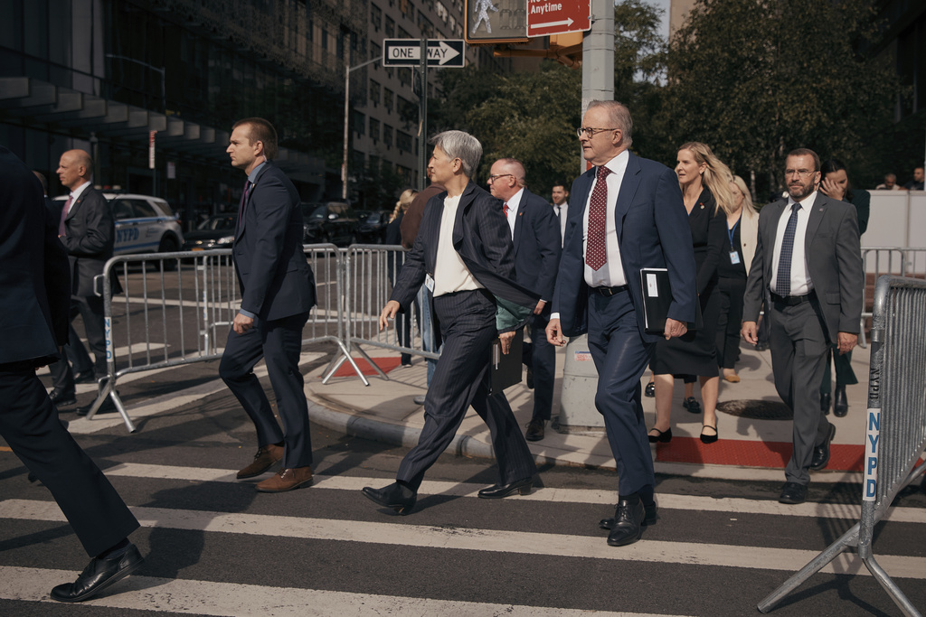Australian Prime Minister Anthony Albanese, center right, and Minister for Foreign Affairs of the Commonwealth of Australia Penny Wong, center left, walk towards the United Nations headquarters during the 80th session of the United Nations General Assembly in New York, Sunday, Sept. 21, 2025. (AP Photo/Andres Kudacki)