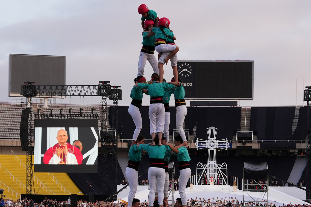 Performers make a human tower, known as Castells, for Pope Leo XIV as he leads a vigil of prayer at the Lluis Companys Olympic Stadium, in Barcelona, Tuesday, June 9, 2026. (AP Photo/Alessandra Tarantino)
