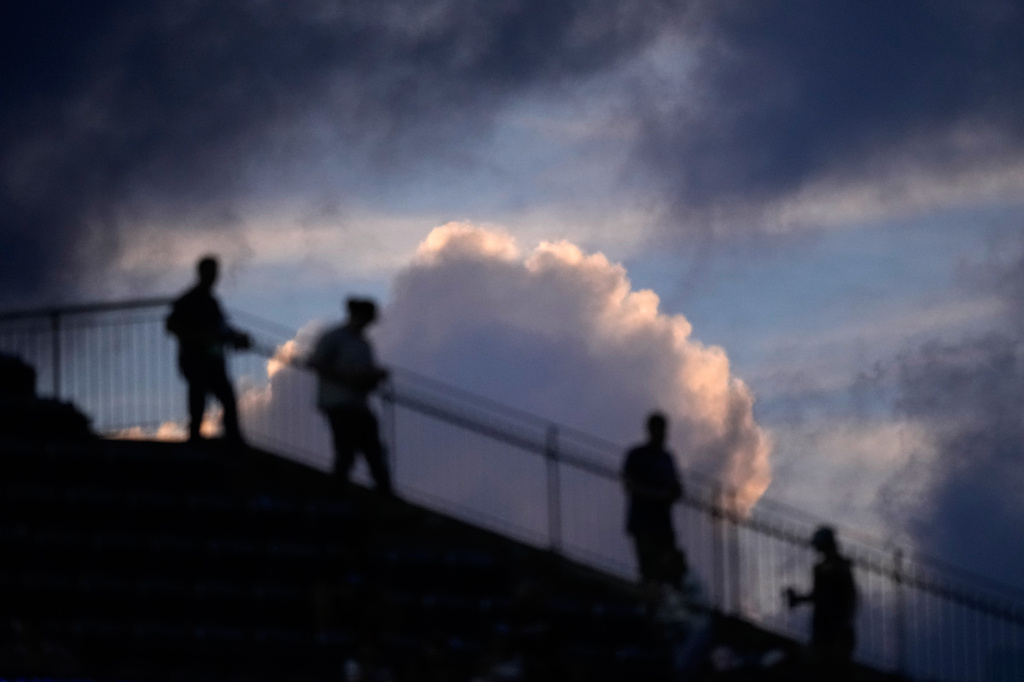 Fans walk down the stands during the fourth inning of a baseball game between the Philadelphia Phillies and the Washington Nationals Wednesday, Aug. 5, 2026, in Philadelphia. (AP Photo/Matt Slocum)
