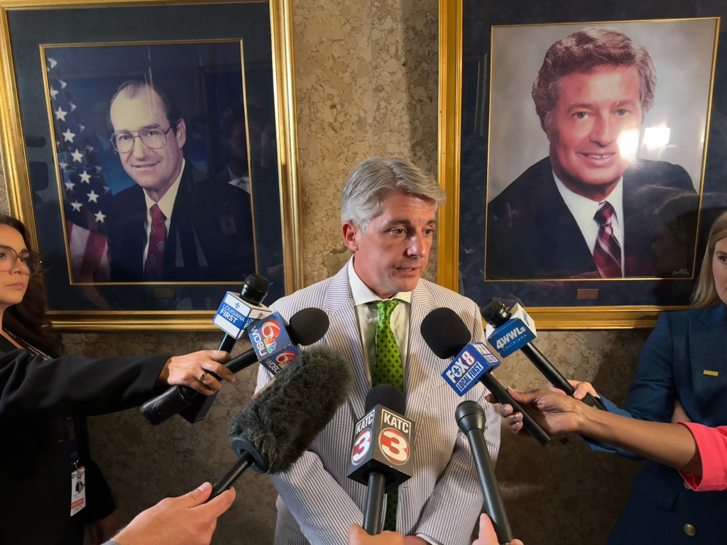 Louisiana Senate President Cameron Henry speaks to reporters in Baton Rouge, La., on Thursday, May 14, 2026, after the Senate approved a map eliminating one of the two majority Black congressional districts and giving Republicans a likely extra U.S. House seat. (AP Photo/Jack Brook)