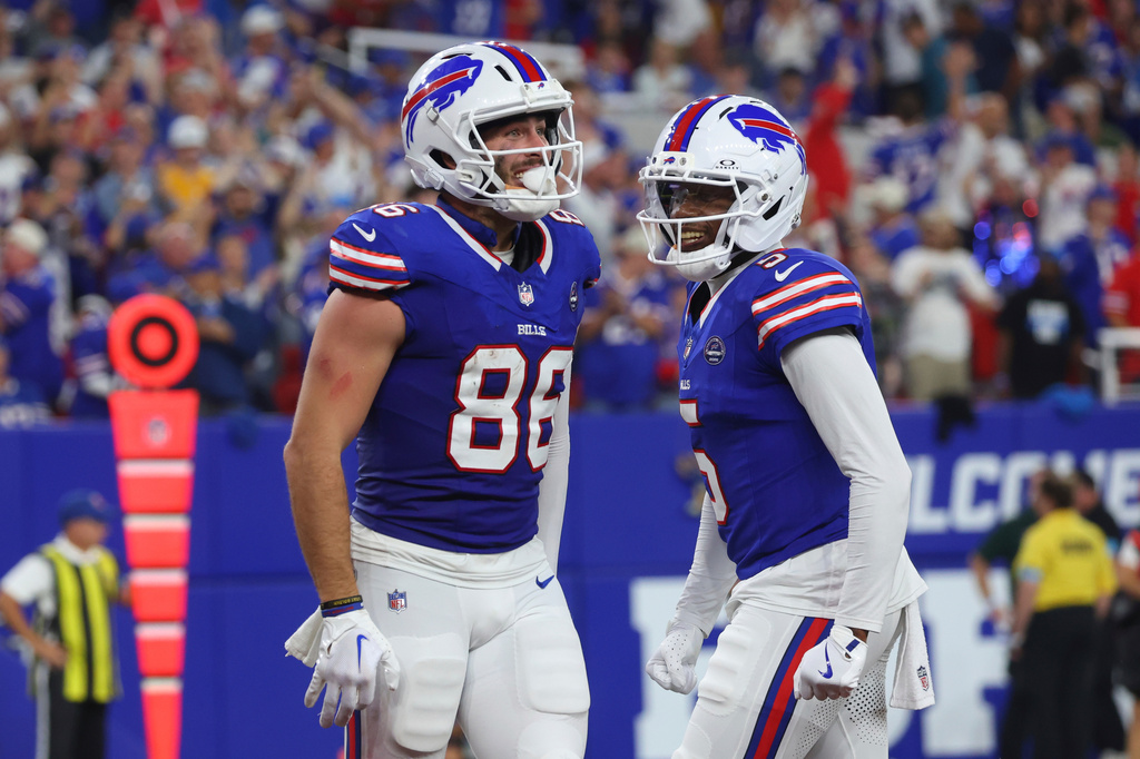 Buffalo Bills tight end Dalton Kincaid (86) celebrates his touchdown with Josh Palmer (5) during the first half of an NFL football game against the Detroit Lions in Orchard Park, N.Y., Thursday, Sept. 17, 2026. (AP Photo/Jeffrey T. Barnes)