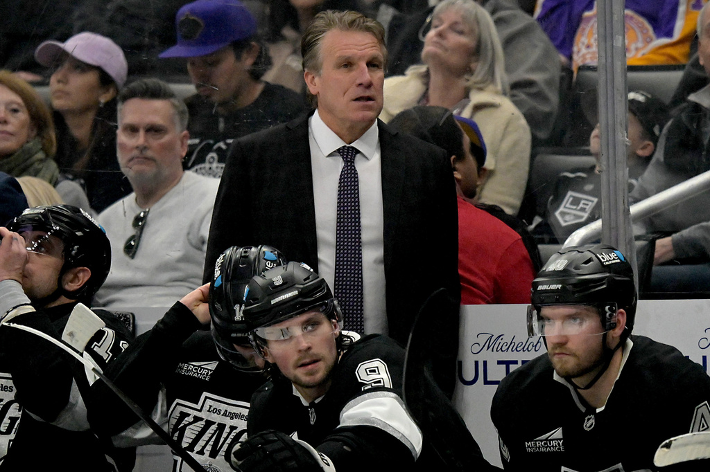 FILE - Los Angeles Kings head coach Jim Hiller stands behind the bench during an NHL hockey game against the Tampa Bay Lightning, Jan. 1, 2026, in Los Angeles. (AP Photo/Jayne Kamin-Oncea, File)
