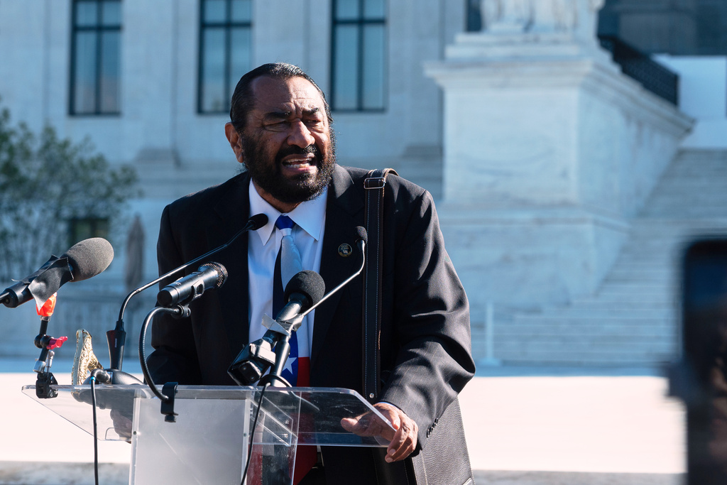 Rep. Al Green, D-Texas, speaks to voting rights activists outside the Supreme Court in Washington, early Wednesday, Oct. 15, 2025, as the justices prepare to take up a major Republican-led challenge to the Voting Rights Act, the centerpiece legislation of the Civil Rights Movement. (AP Photo/Cliff Owen)