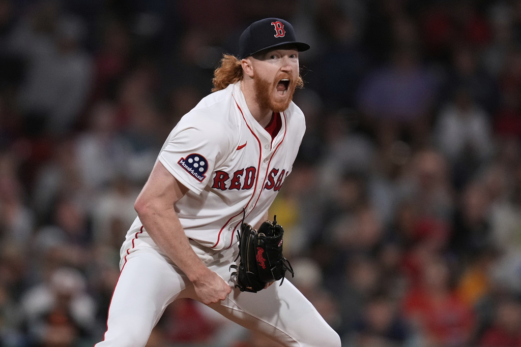 Boston Red Sox pitcher Dustin May reacts after the final out of the top of the sixth inning of a baseball game against the Baltimore Orioles at Fenway Park, Monday, Aug. 18, 2025, in Boston. (AP Photo/Charles Krupa)