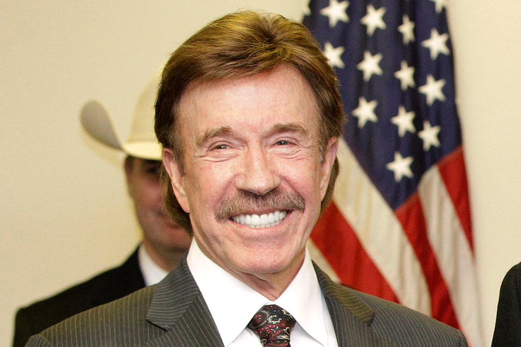FILE - Chuck Norris appears at a ceremony in Garland, Texas on Dec. 2, 2010. (AP Photo/Tony Gutierrez, File)