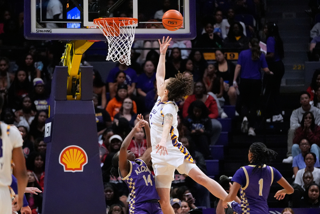 LSU forward Grace Knox (2) goes to the basket over Alcorn State forward Arene Iyekekpolor (14) in the first half an NCAA college basketball game in Baton Rouge, La., Thursday, Nov. 20, 2025. (AP Photo/Gerald Herbert)