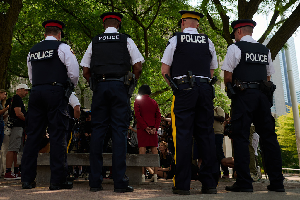Toronto Mayor Olivia Chow is joined by police as she speaks to media after a shot was fired at the U.S. Consulate in Toronto, on Monday, July 27, 2026. (Sammy Kogan/The Canadian Press via AP)