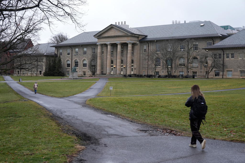 FILE - People walk on the campus of Cornell University in Ithaca, N.Y., Friday, Feb. 2, 2024. (AP Photo/Seth Wenig, file)