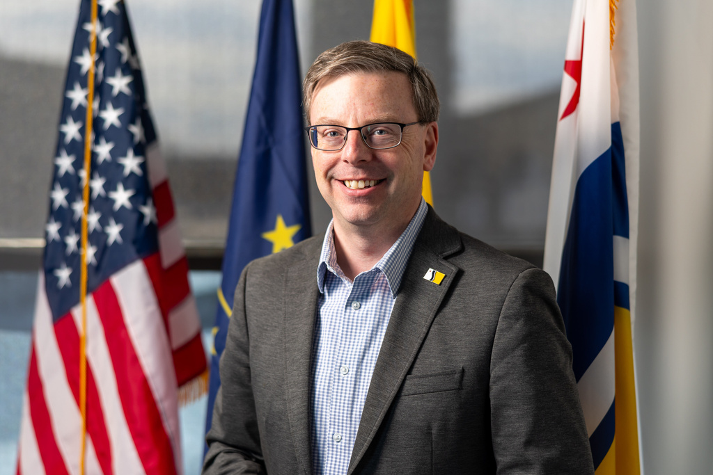 Mayor James Mueller poses for a portrait Thursday, Feb. 19, 2026, at City Hall in South Bend, Ind. (AP Photo/Michael Caterina)