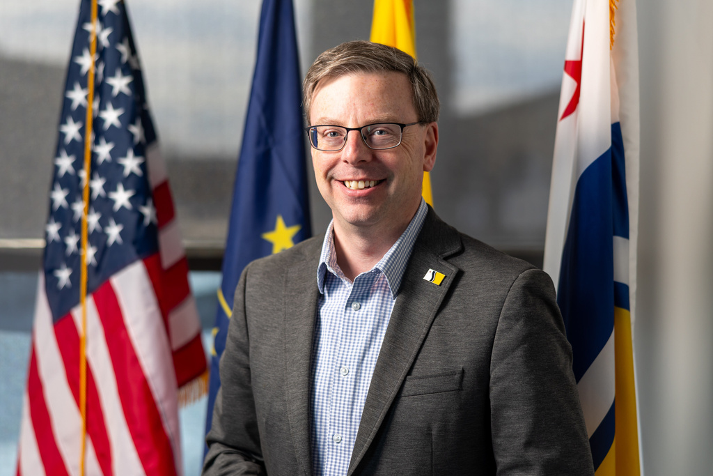 Mayor James Mueller poses for a portrait Thursday, Feb. 19, 2026, at City Hall in South Bend, Ind. (AP Photo/Michael Caterina)
