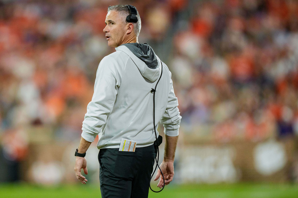 Florida State head coach Mike Norvell looks on during the first half of an NCAA college football game against Clemson, Saturday, Nov. 8, 2025, in Clemson, S.C. (AP Photo/Jacob Kupferman)