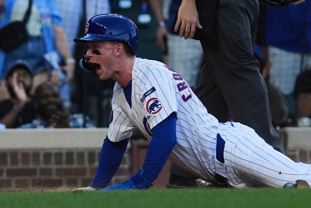 Chicago Cubs' Pete Crow-Armstrong reacts after scoring on a two-run double by Dansby Swanson during the sixth inning of a baseball game against the Atlanta Braves in Chicago, Monday, Sept. 1, 2025. (AP Photo/Nam Y. Huh)