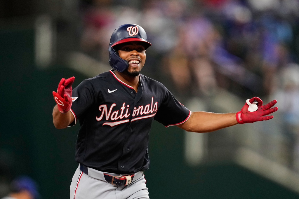 Washington Nationals' José Tena celebrates his solo home run in the third inning of a baseball game against the Texas Rangers Wednesday, Aug. 19, 2026, in Arlington, Texas. (AP Photo/Tony Gutierrez)