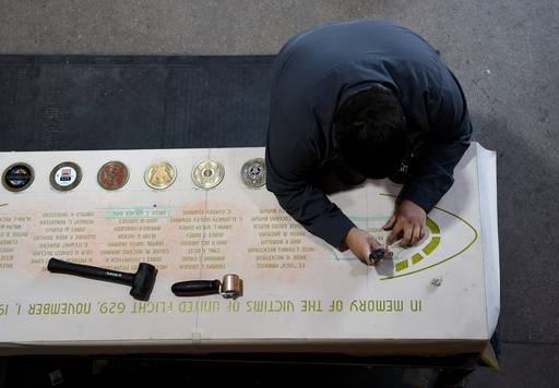 Jorge Arredondo works on the United Air Lines Flight 629 memorial in Greeley, Colo., Wednesday, Oct. 15, 2025. (AP Photo/Thomas Peipert) Jorge Arredondo works on the United Air Lines Flight 629 memorial in Greeley, Colo., Wednesday, Oct. 15, 2025. (AP Photo/Thomas Peipert)