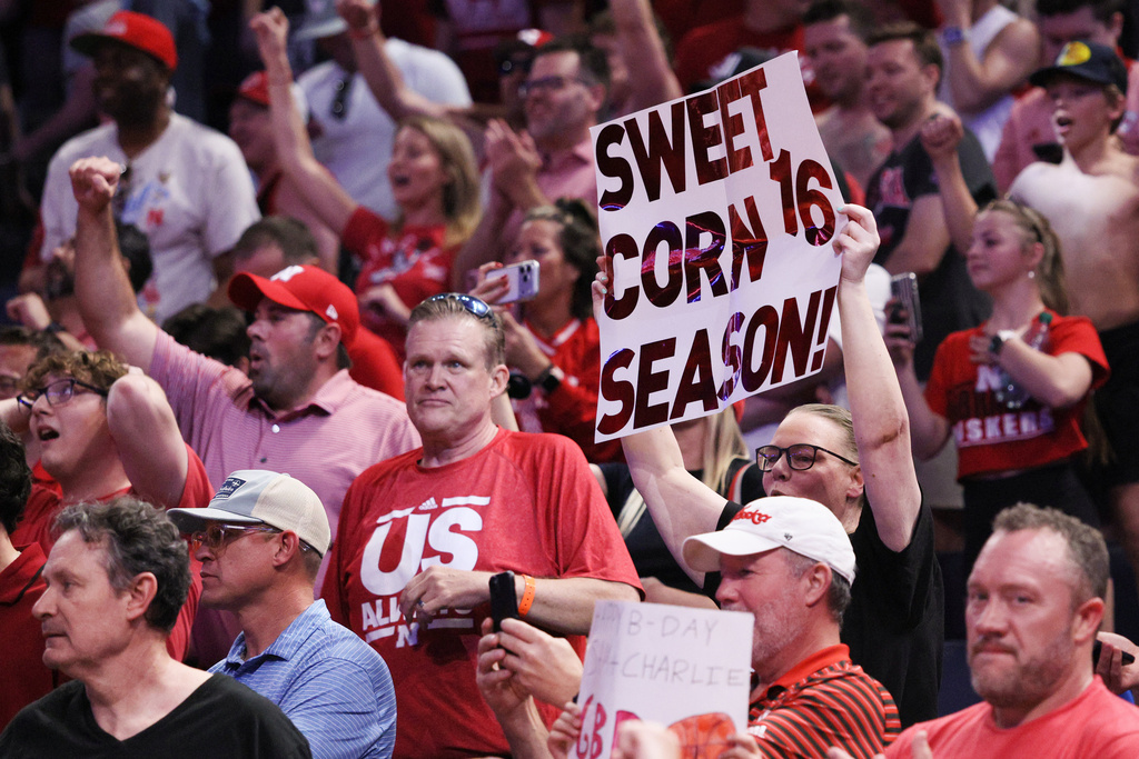 A Nebraska fan holds a sign after a game against Vanberbilt in the second round of the NCAA college basketball tournament, Saturday, March 21, 2026, in Oklahoma City. (AP Photo/Nate Billings)