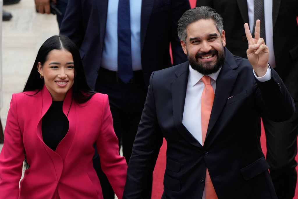 National Assembly lawmaker Nicolas Maduro Guerra, son of deposed President Nicolas Maduro, and his wife Grysell Torres arrive at the National Assembly for Venezuela’s acting President Delcy Rodriguez first state of the union address in Caracas, Venezuela, Thursday, Jan. 15, 2026. (AP Photo/Ariana Cubillos)