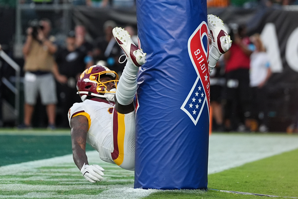 Washington Commanders wide receiver Stefon Diggs (3) celebrates his touchdown against the Philadelphia Eagles during the second half of an NFL football game, Sunday, Sept. 13, 2026, in Philadelphia. (AP Photo/Matt Rourke)