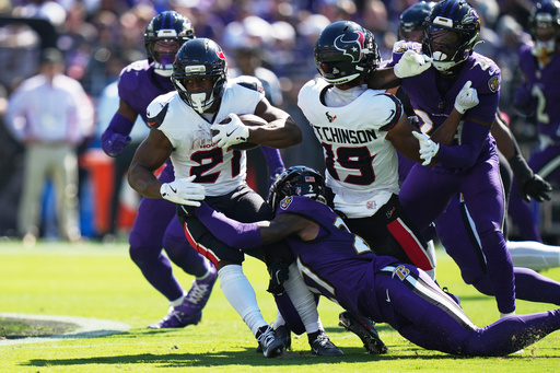 Houston Texans running back Nick Chubb (21) is tackled by Baltimore Ravens cornerback T.J. Tampa (27) during the first half of an NFL football game, Sunday, Oct. 5, 2025, in Baltimore. (AP Photo/Stephanie Scarbrough) Houston Texans running back Nick Chubb (21) is tackled by Baltimore Ravens cornerback T.J. Tampa (27) during the first half of an NFL football game, Sunday, Oct. 5, 2025, in Baltimore. (AP Photo/Stephanie Scarbrough)