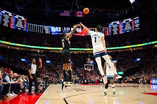 Portland Trail Blazers forward Jerami Grant (9) shoots a three-pointer past Minnesota Timberwolves guard/forward Terrence Shannon Jr. (1) during the first half of an NBA basketball game on Wednesday, Oct. 22, 2025, in Portland, Ore. (AP Photo/Molly J. Smith) Portland Trail Blazers forward Jerami Grant (9) shoots a three-pointer past Minnesota Timberwolves guard/forward Terrence Shannon Jr. (1) during the first half of an NBA basketball game on Wednesday, Oct. 22, 2025, in Portland, Ore. (AP Photo/Molly J. Smith)
