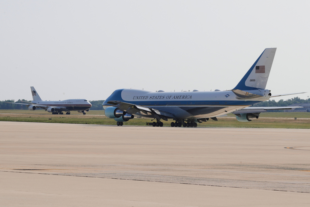 The newly designated Air Force One, left, with president Donald Trump on board, takes off on the runway as the old version of the plane is in the foreground, at Joint Base Andrews, Md., Wednesday, July 1, 2026 (AP Photo/Luis M. Alvarez)