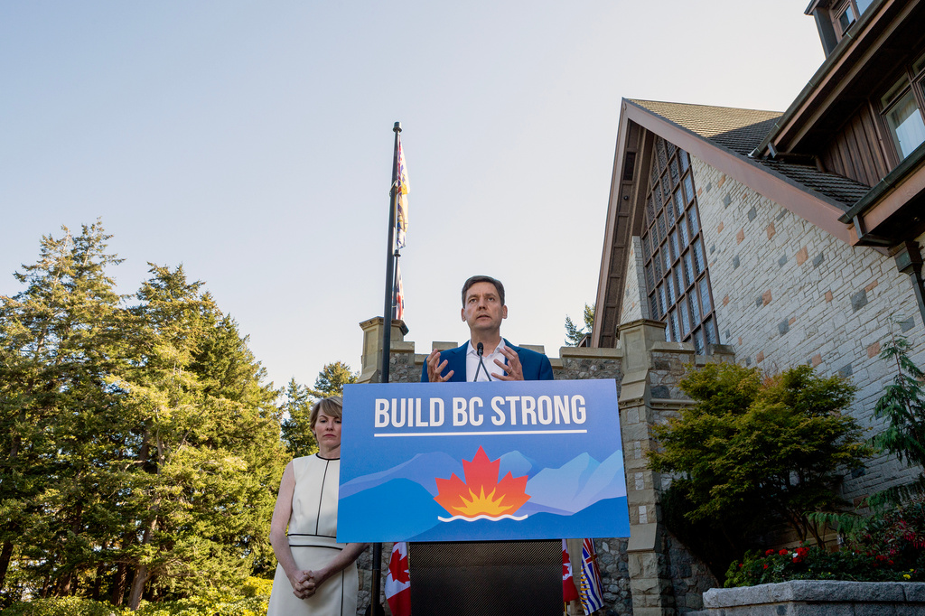 British Columbia Premier David Eby is joined by his wife Dr. Cailey Lynch before announcing a snap election during a press conference at Government House in Victoria, British Columbia, Canada, Tuesday, Sept. 22, 2026.(Chad Hipolito/The Canadian Press via AP)