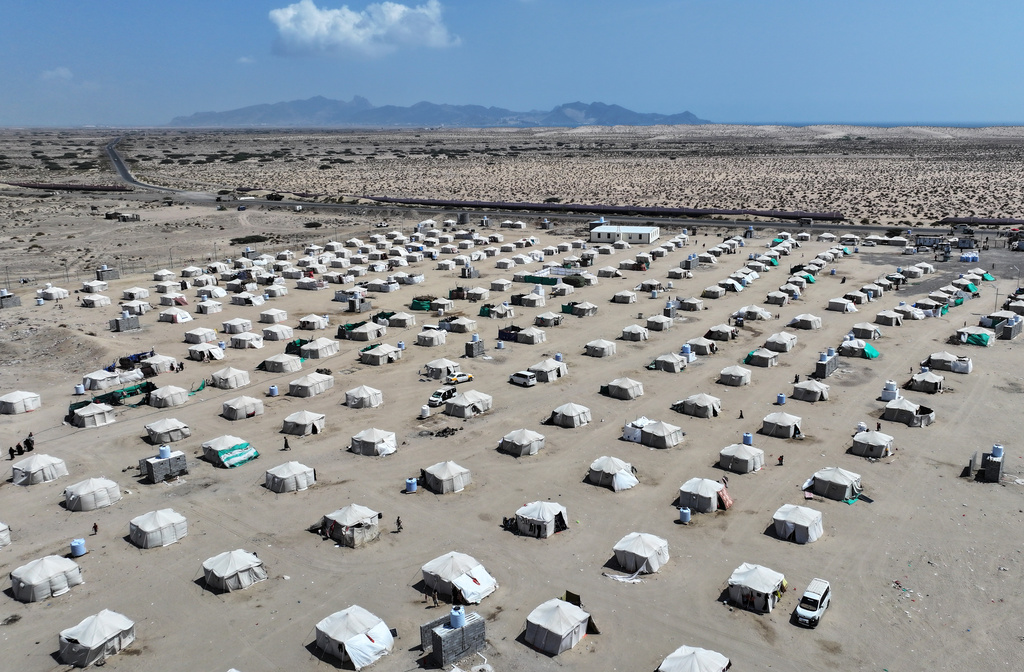An aerial view shows rows of tents sheltering displaced Yemenis at the Al-Fardous displacement camp in Ras Imran, on the outskirts of Aden, Yemen, Sunday, Oct. 25, 2026. (AP Photo/Abdulnasser Alseddik)