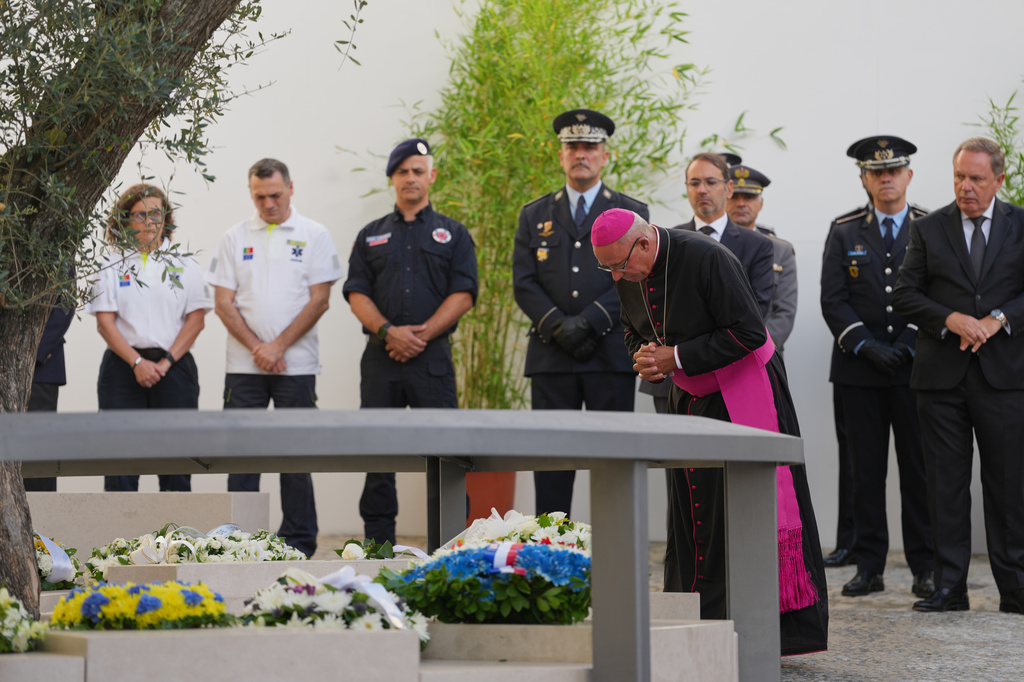 Lisbon patriarch bishop Rui Valério attends the inauguration of a memorial to the 16 people killed in the derailment and crash of Lisbon's Glória funicular, an iconic streetcar, on the first anniversary of the accident, Thursday, Sept. 3, 2026. (AP Photo/Armando Franca)