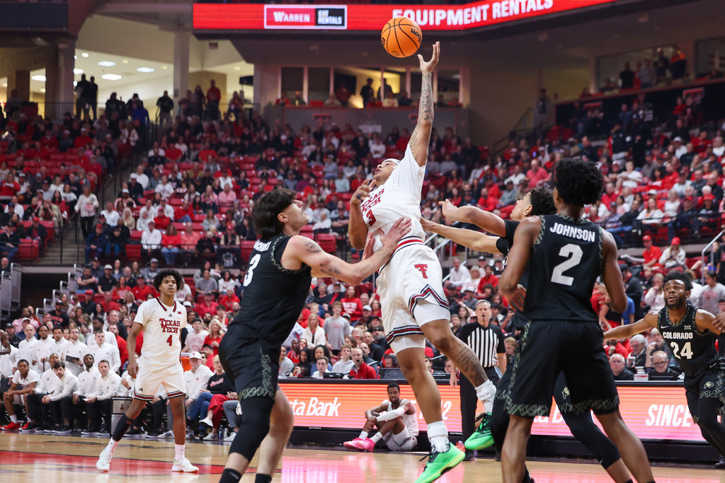 Texas Tech forward Lejuan Watts (3) gets a rebound over Colorado forward Alon Michaeli (3) during the first half of an NCAA college basketball game, Wednesday, Feb. 11, 2026, in Lubbock, Texas. (AP Photo/Chase Seabolt)