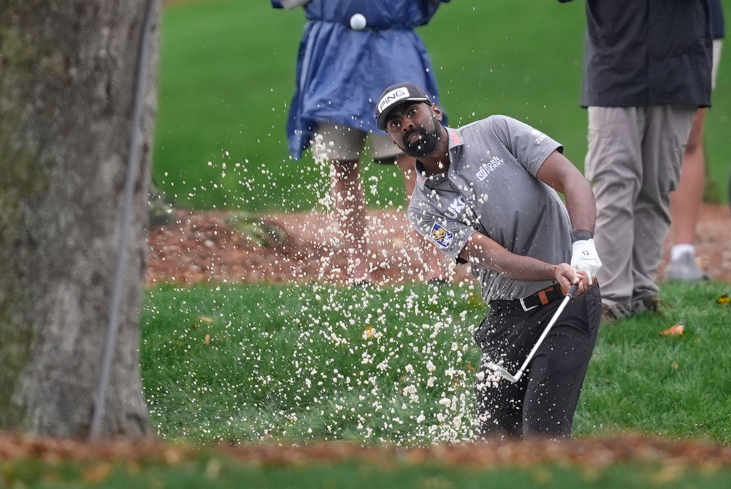 Sahith Theegala hits from the rough on the ninth hole during the first round of The Players Championship golf tournament Thursday, March 12, 2026, in Ponte Bedra Beach, Fla. (AP Photo/Gerald Herbert)