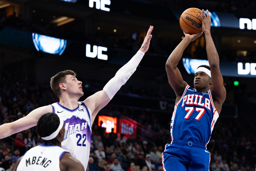 Philadelphia 76ers guard VJ Edgecombe (77) looks to shoot over Utah Jazz center Kyle Filipowski (22) during the first half of an NBA basketball game, Saturday, March 21, 2026, in Salt Lake City. (AP Photo/Anna Fuder)