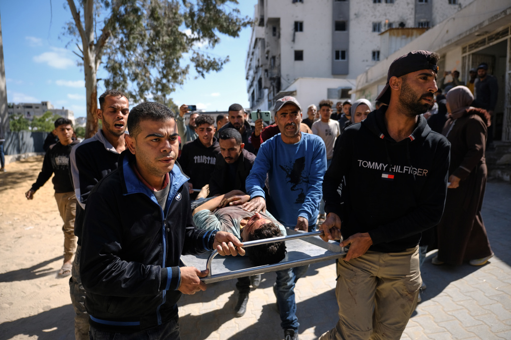 The body of Hamdan Kashko, who was killed in an Israeli airstrike, I brought to Shifa Hospital in Gaza City Thursday, May 7, 2026. (AP Photo/Jehad Alshrafi)