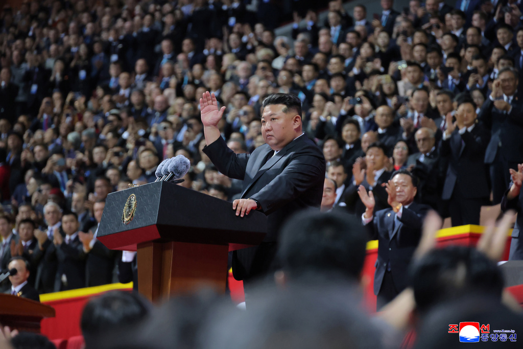 In this photo provided by North Korean government, North Korean leader Kim Jong Un, center, waves during the ceremony marking the 80th anniversary of the ruling Workers’ Party, in Pyongyang, North Korea, Thursday, Oct. 9, 2025. Independent journalists were not given access to cover the event depicted in this image distributed by the North Korean government. The content of this image is as provided and cannot be independently verified. Korean language watermark on image as provided by source reads: "KCNA" which is the abbreviation for Korean Central News Agency. (Korean Central News Agency/Korea News Service via AP)