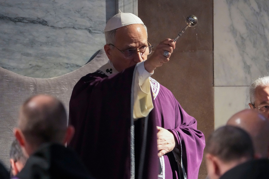 Pope Leo XIV blesses the ashes during Ash Wednesday Mass, marking the start of Catholic Lent, inside the Basilica of Santa Sabina in Rome, Wednesday, Feb. 18, 2026. (AP Photo/Gregorio Borgia)