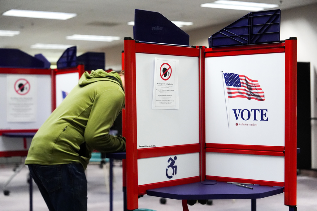 A person votes early in the Virginia redistricting referendum at the Fairfax County Government Center, Friday, April 3, 2026, in Fairfax, Va. (AP Photo/Julia Demaree Nikhinson)