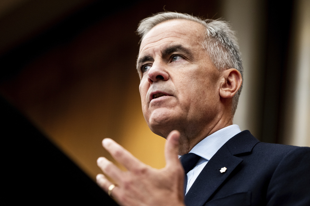 Prime Minister Mark Carney speaks during a news conference at the National Press Theatre in Ottawa on Friday, Aug. 22, 2025. (Spencer Colby/The Canadian Press via AP)