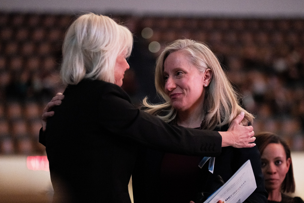 National Transportation Safety Board Chairman Jennifer Homendy hugs Virginia Gov. Abigail Spanberger at an event honoring the 67 people killed in the 2025 midair collision near Washington Reagan National Airport, Wednesday, Jan. 28, 2026, in Washington. (AP Photo/Allison Robbert)