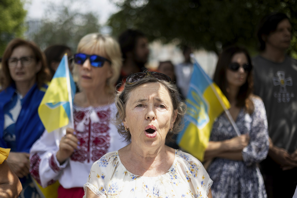 People take part in a gathering to mark Ukraine's Independence Day at central Syntagma square, in Athens, Greece, on Sunday, Aug. 24, 2025. (AP Photo/Yorgos Karahalis)