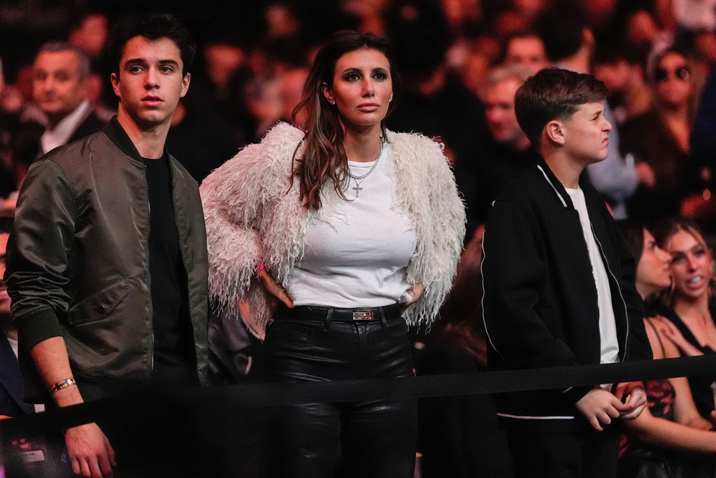 Alina Habba, center, watches the UFC 322 mixed martial arts event, Saturday, Nov. 15, 2025, in New York. (AP Photo/Yuki Iwamura)