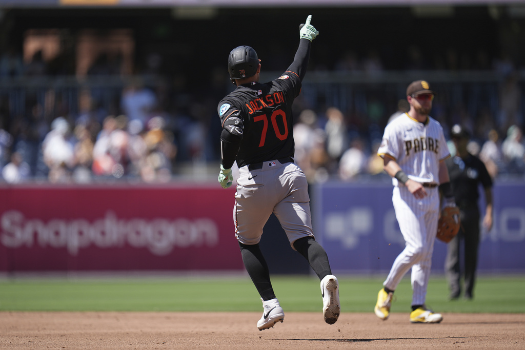 Baltimore Orioles' Alex Jackson, right, celebrates after hitting a home run during the third inning of a baseball game against the San Diego Padres Wednesday, Sept. 3, 2025, in San Diego. (AP Photo/Gregory Bull)