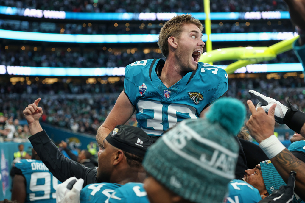 Jacksonville Jaguars place kicker Cam Little (39) celebrates after scoring the winning field goal during an NFL football game against Philadelphia Eagles in London, Sunday, Oct. 11, 2026. (AP Photo/Ian Walton)