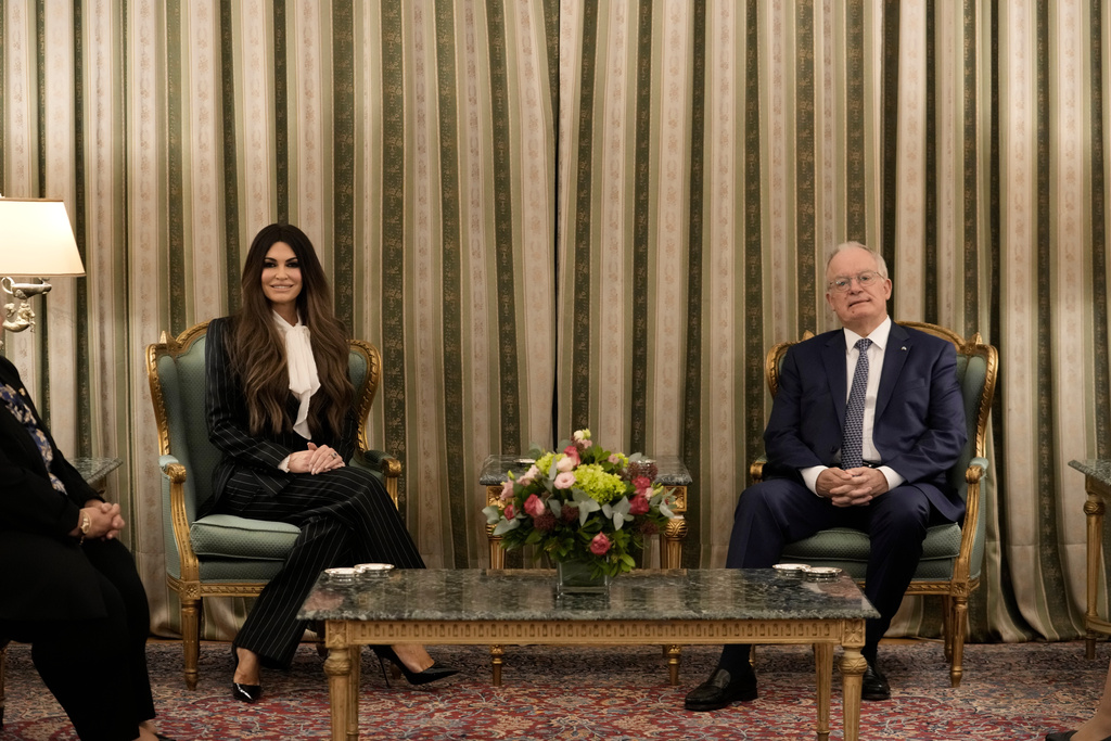 Kimberly Guilfoyle, the new U.S. Ambassador to Greece and first woman to hold the post, speaks with Greek President Constantine Tassoulas during a ceremony to present her diplomatic credentials at the Presidential Palace in Athens, Greece, Tuesday, Nov. 4, 2025. (AP Photo/Petros Giannakouris)