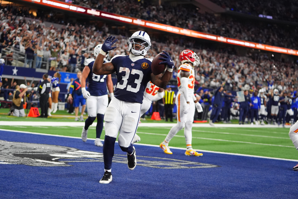 Dallas Cowboys running back Javonte Williams (33) celebrates after scoring during the second half of an NFL football game against the Kansas City Chiefs Thursday, Nov. 27, 2025, in Arlington, Texas. (AP Photo/LM Otero)