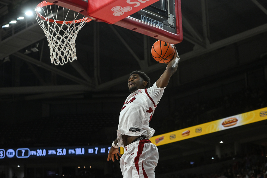 Arkansas guard Billy Richmond III (24) goes up for a dunk on a fast break against Jackson State during the first half of an NCAA college basketball game Friday, Nov. 21, 2025, in Fayetteville, Ark. (AP Photo/Michael Woods)