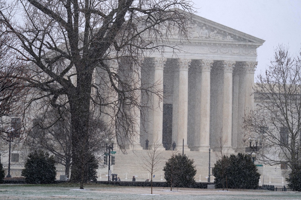 The U.S. Supreme Court is seen during a snowy day on Capitol Hill Thursday, March 12, 2026, in Washington. (AP Photo/Jose Luis Magana)