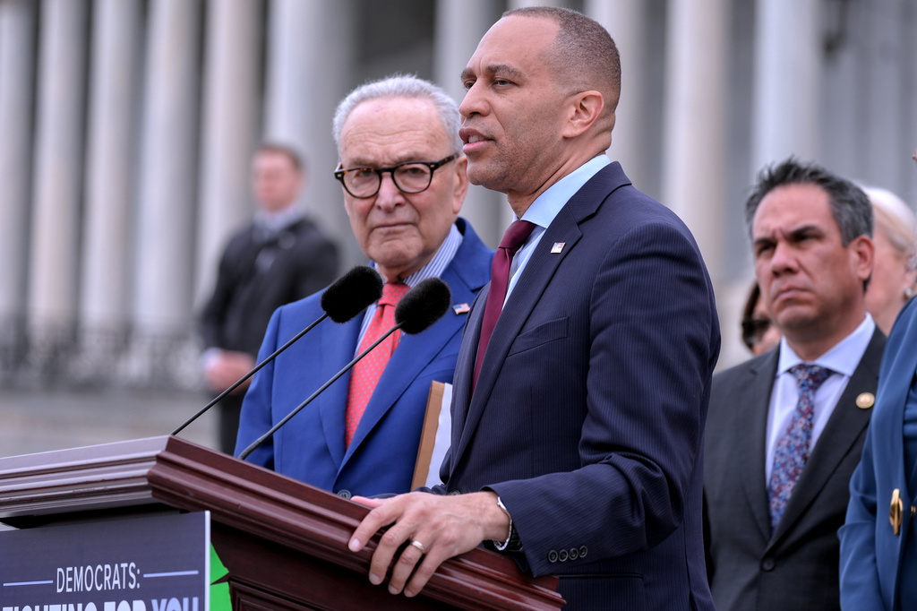 House Minority Leader Hakeem Jeffries, D-N.Y., center, speaks as Senate Minority Leader Chuck Schumer, D-N.Y., left, Vice Chair Rep. Pete Aguilar, D-Calif., right, listen during a news conference, Thursday, May 21, 2026, on Capitol Hill, in Washington. (AP Photo/Mariam Zuhaib)