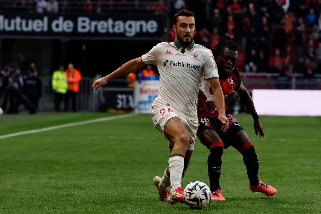 Rennes' Anthony Rouault dribbles Nice's Hamza Koutoune during the French League One soccer match between Rennes and Nice, Sunday Oct. 26, 2025 in Rennes, western France. (AP Photo/Jeremias Gonzalez)