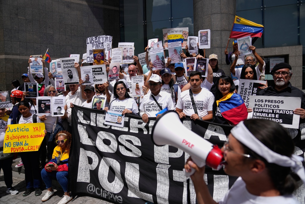 People who consider their detained family members to be political prisoners call for their releases outside the United Nations office in Caracas, Venezuela, Wednesday Feb. 18, 2026. (AP Photo/Ariana Cubillos)
