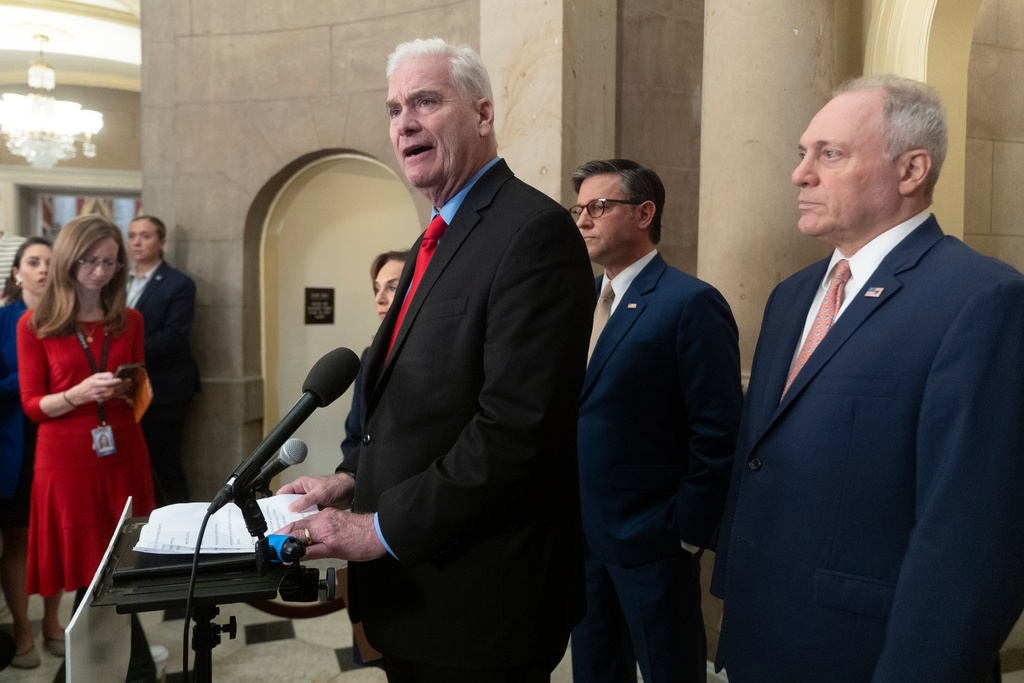House Majority Whip Tom Emmer, R-Mn., center, with House Majority Leader Steve Scalise, R-La., from right, and House Speaker Mike Johnson, R-La., speaks during a news conference at the Capitol, Thursday, Oct. 2, 2025, in Washington. (AP Photo/Manuel ,Balce Ceneta)
